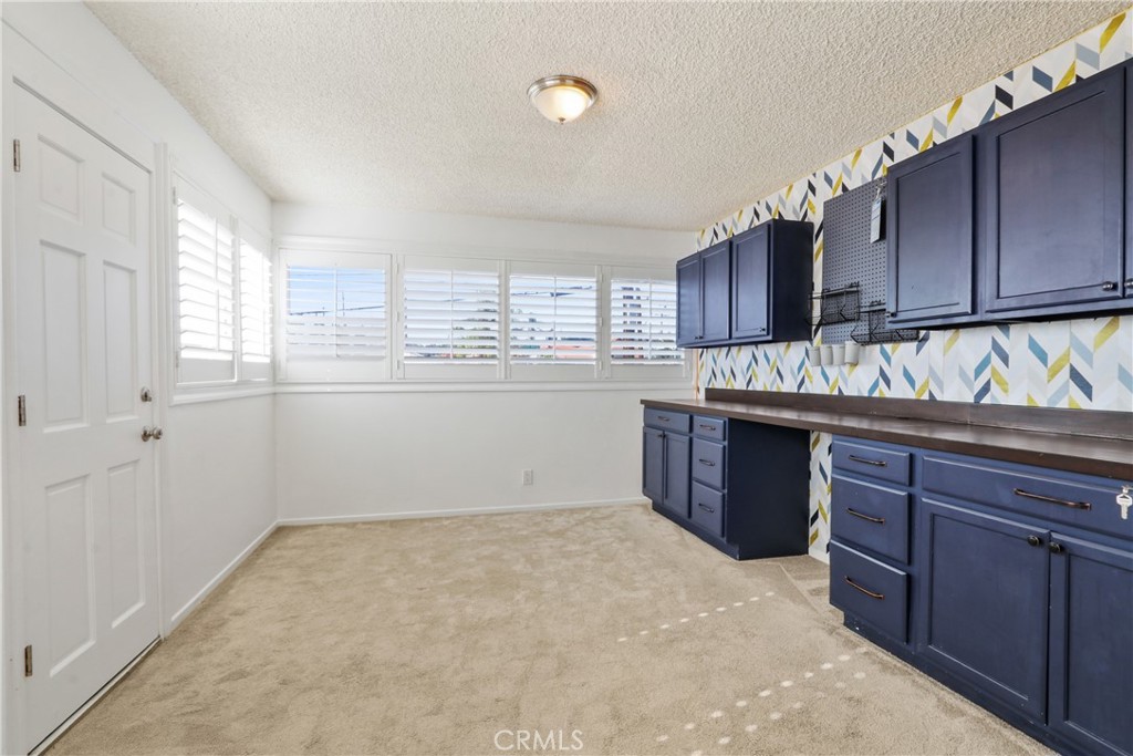 657 Wilber Place Montebello, CA 90640 - Photo 13 of 32 a kitchen with a stove a sink and a refrigerator