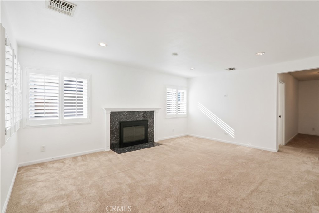 657 Wilber Place Montebello, CA 90640 - Photo 2 of 32 an empty room with windows and fireplace
