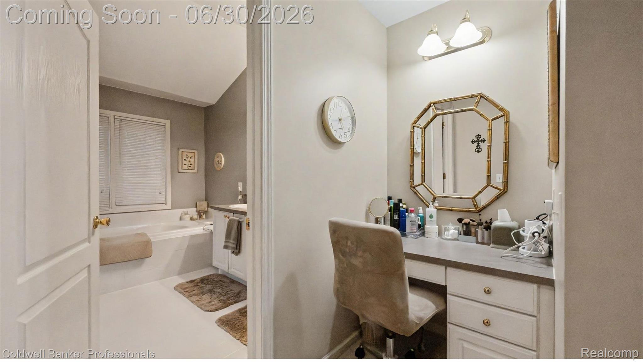 1085 Bloomview Circle Rochester, MI 48307 - Photo 32 of 67 Integrated vanity with drawer storage and a stone-finish countertop, illuminated by a wall-mounted fixture