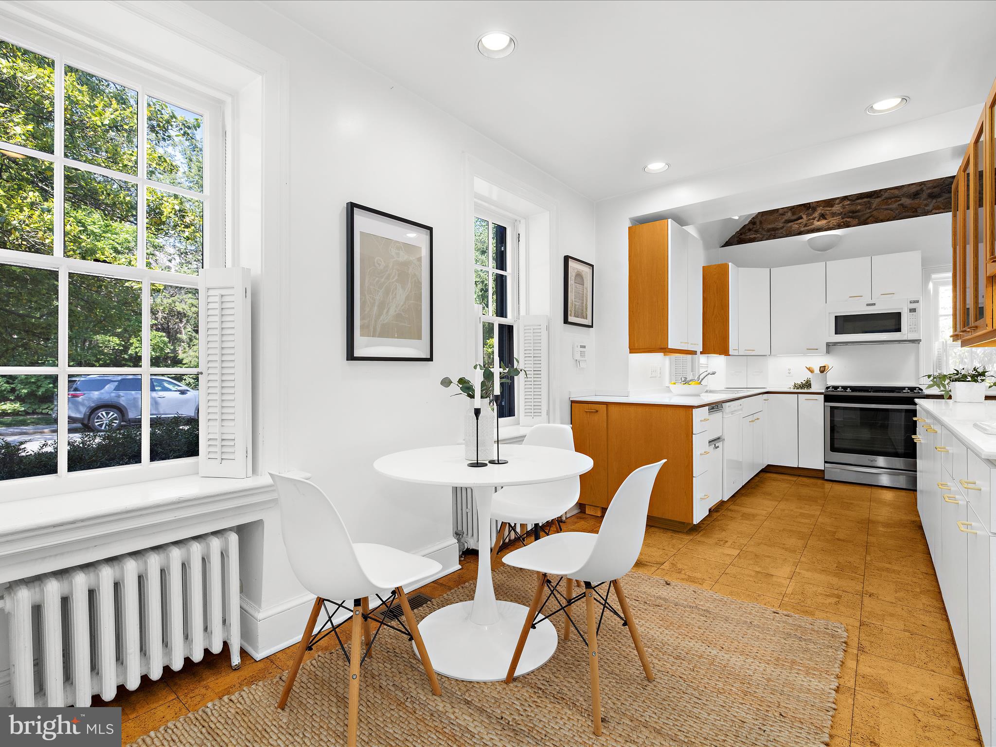 117 Taplow Road Baltimore, MD 21212 - Photo 13 of 57 a view of a dining room with furniture and a window