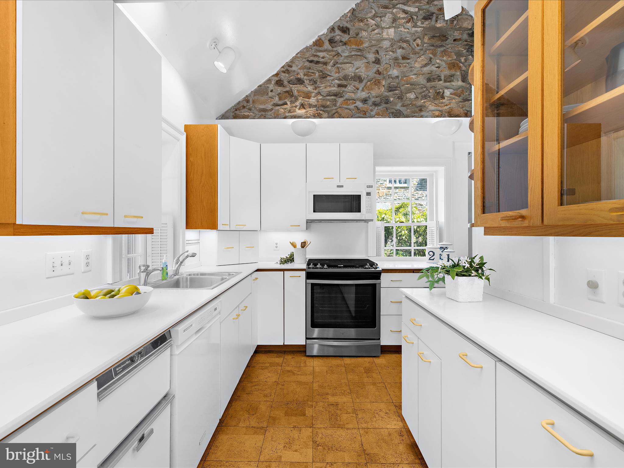 117 Taplow Road Baltimore, MD 21212 - Photo 15 of 57 a kitchen with a sink a stove cabinets and counter space