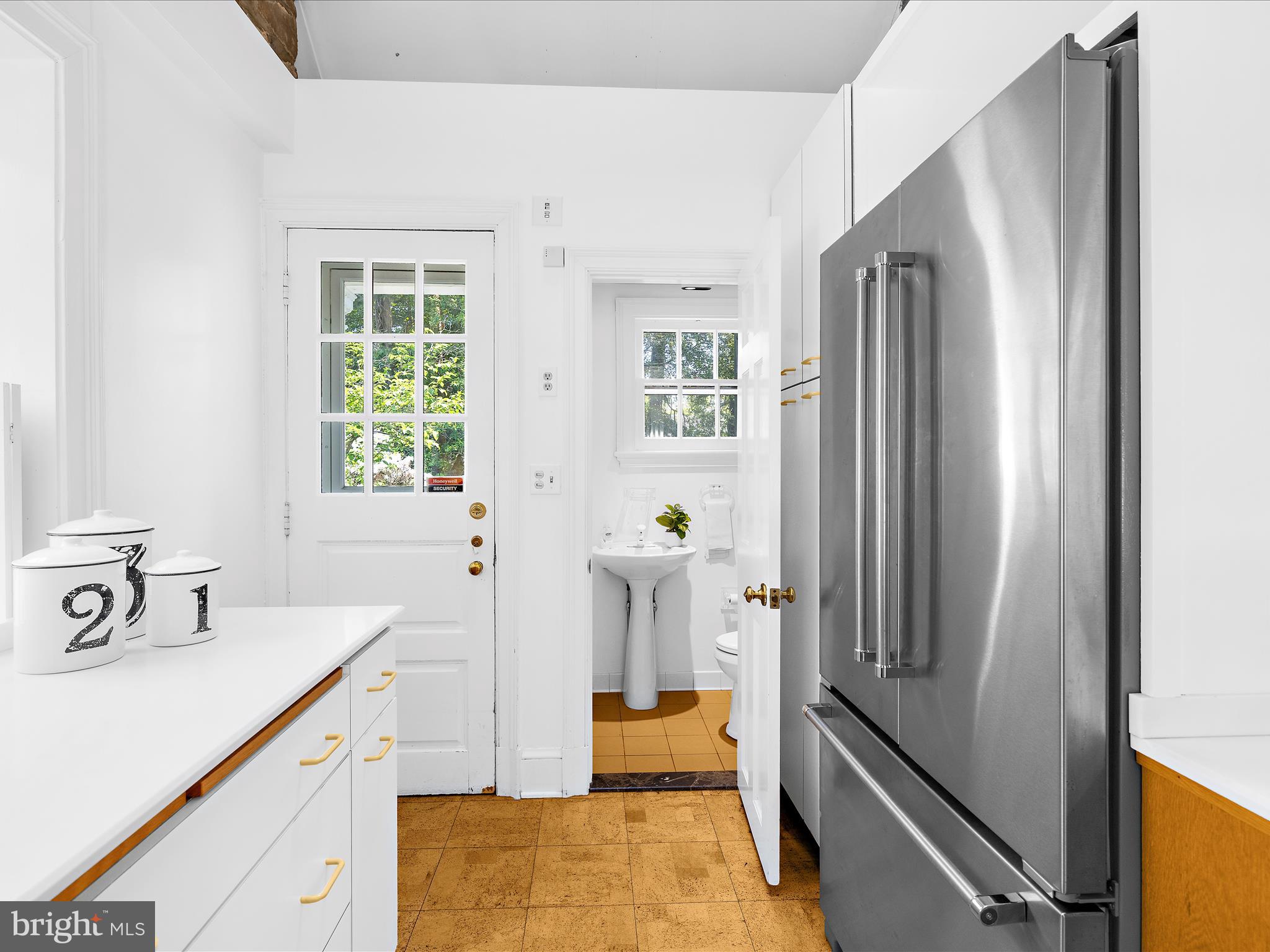 117 Taplow Road Baltimore, MD 21212 - Photo 17 of 57 a bathroom with a sink and a large mirror