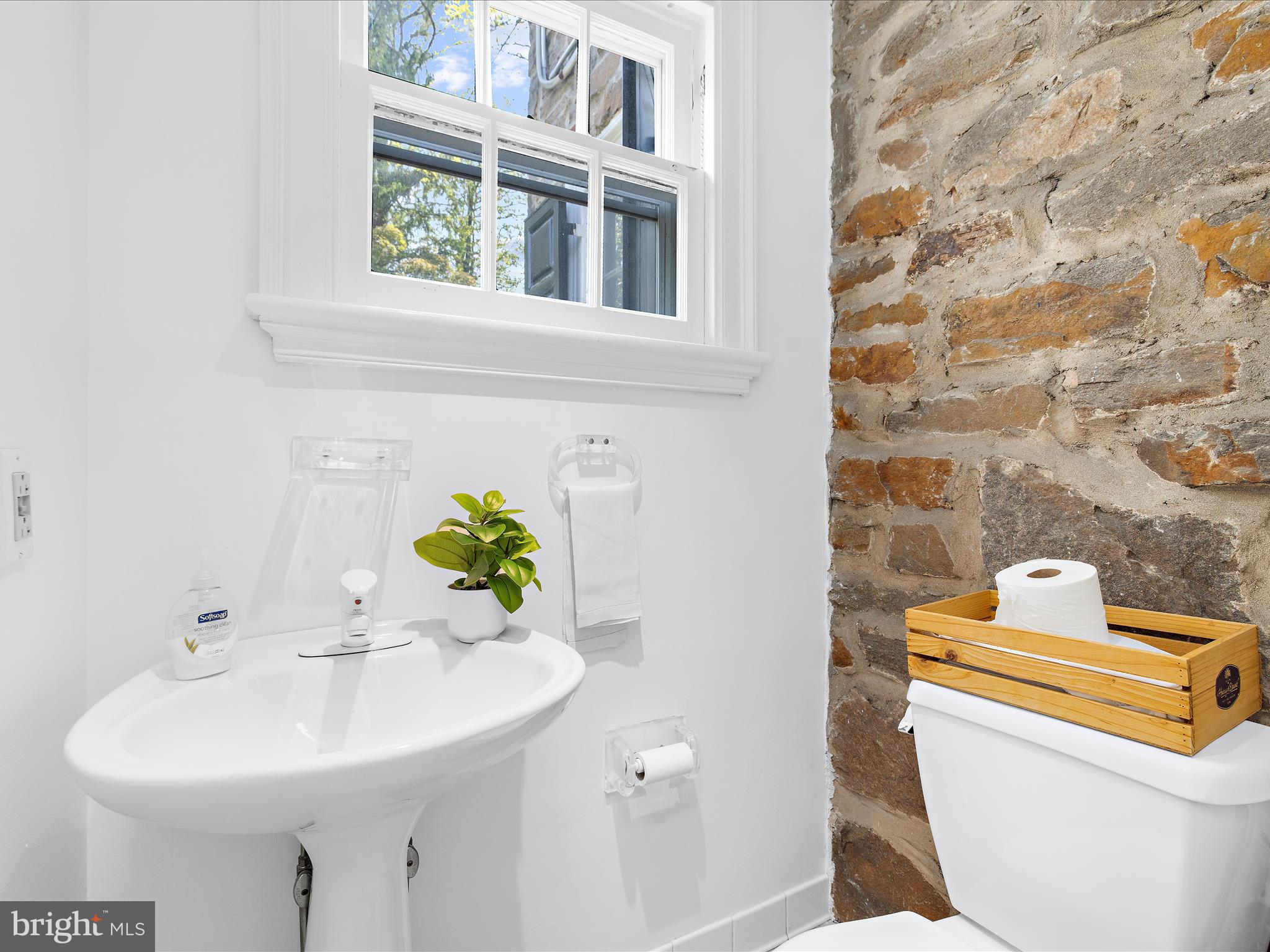 117 Taplow Road Baltimore, MD 21212 - Photo 18 of 57 a bathroom with a sink and a toilet