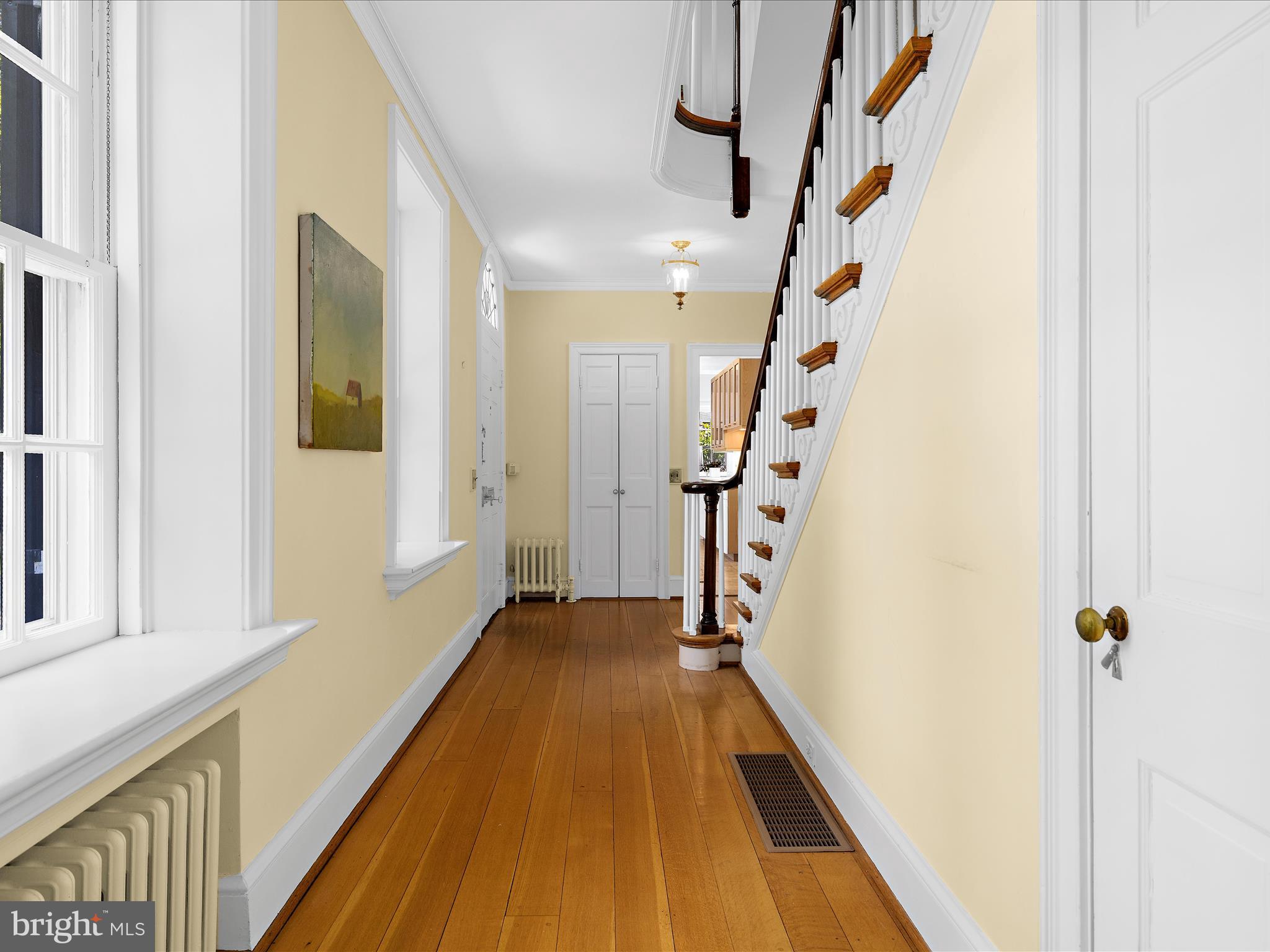 117 Taplow Road Baltimore, MD 21212 - Photo 23 of 57 a view of a hallway with wooden floor and staircase