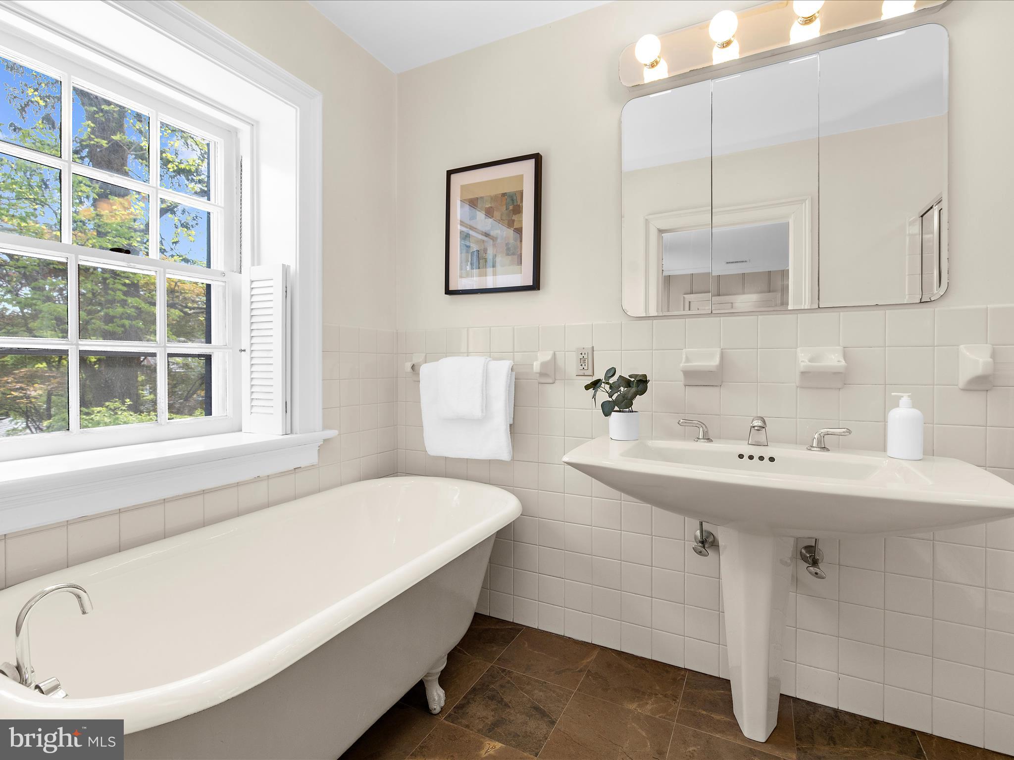 117 Taplow Road Baltimore, MD 21212 - Photo 30 of 57 a bathroom with a sink and a bathtub