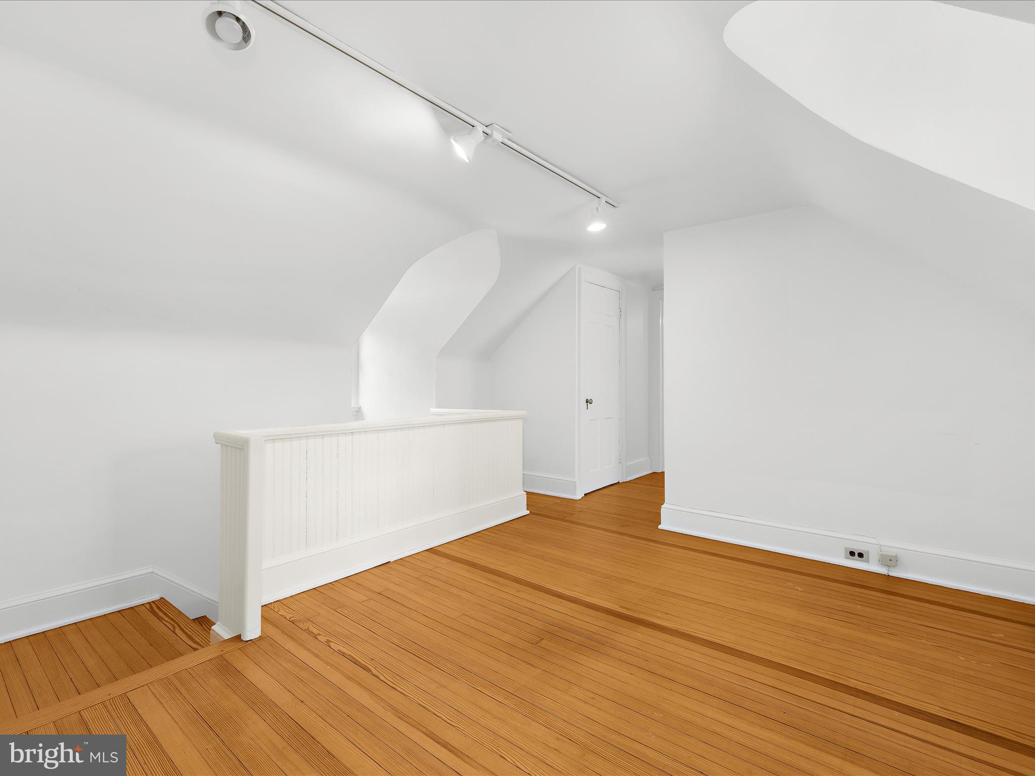 117 Taplow Road Baltimore, MD 21212 - Photo 41 of 57 a view of empty room with wooden floor