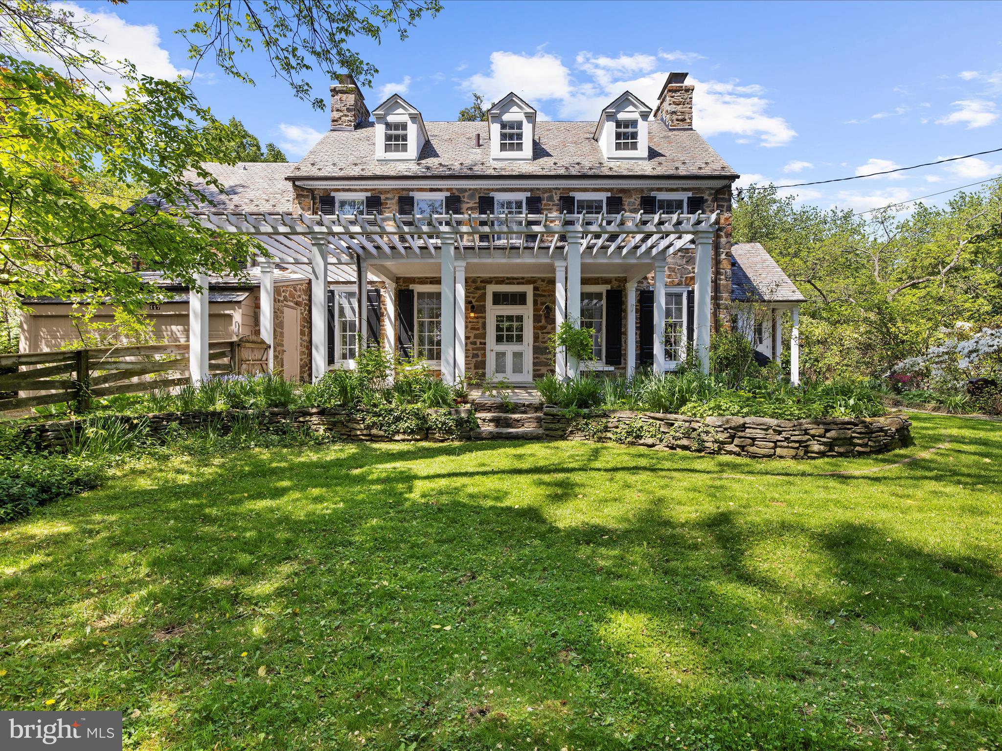 117 Taplow Road Baltimore, MD 21212 - Photo 48 of 57 a front view of a house with a garden