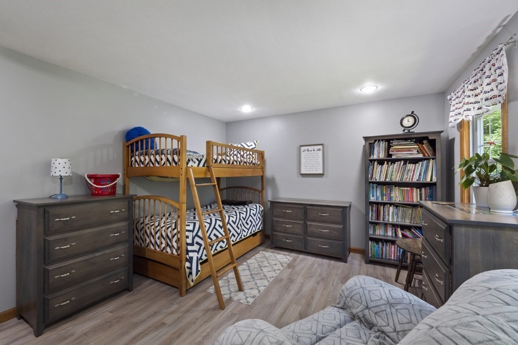 4 Huntington Road Blandford, MA 01008 - Photo 19 of 27 a bedroom with furniture and a book shelf