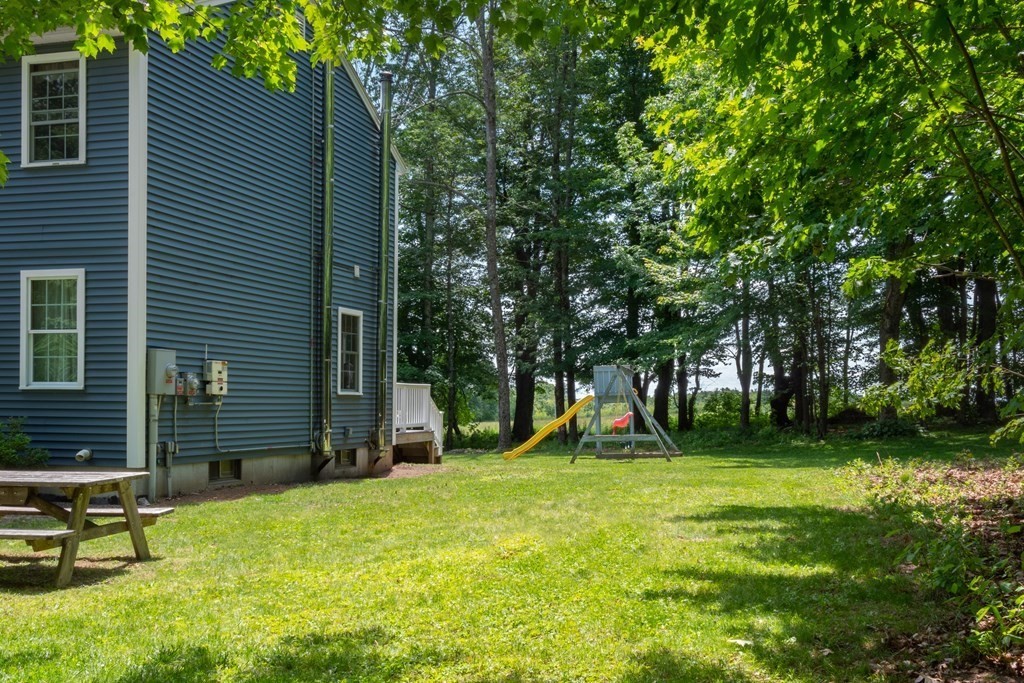 4 Huntington Road Blandford, MA 01008 - Photo 25 of 27 a view of a backyard with a tree