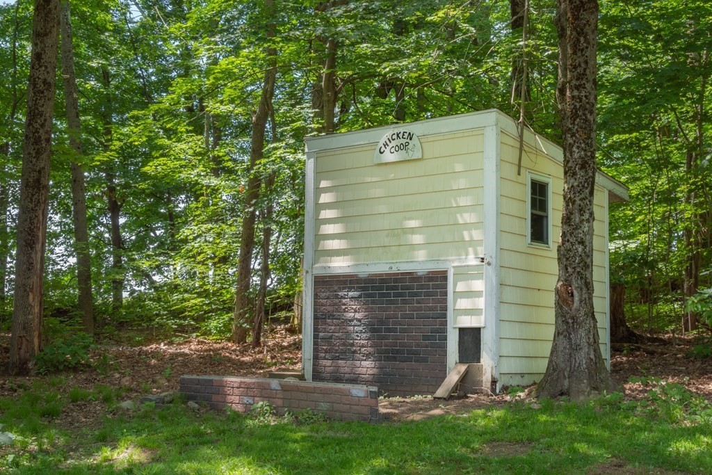 4 Huntington Road Blandford, MA 01008 - Photo 27 of 27 a brick building with a small yard