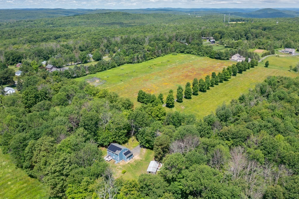 4 Huntington Road Blandford, MA 01008 - Photo 5 of 27 a view of a big yard with lots of green space and deers