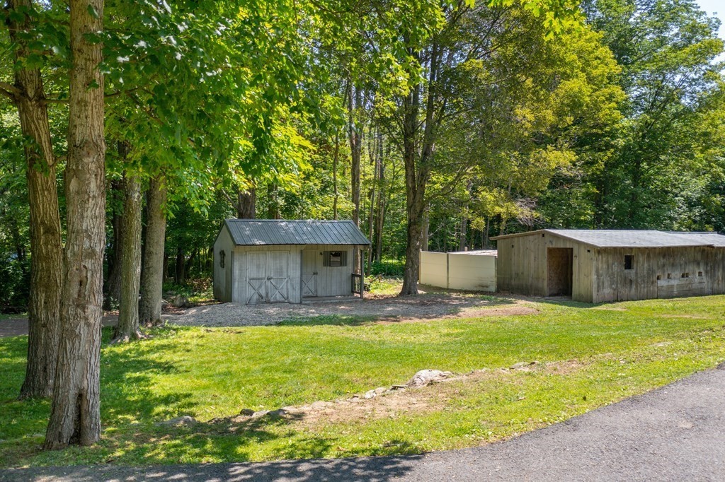 4 Huntington Road Blandford, MA 01008 - Photo 9 of 27 a view of a house with a yard and tree