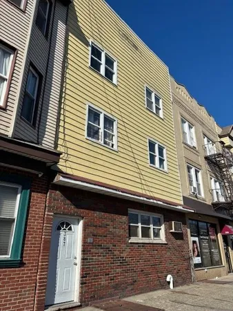 a front view of a house with parking