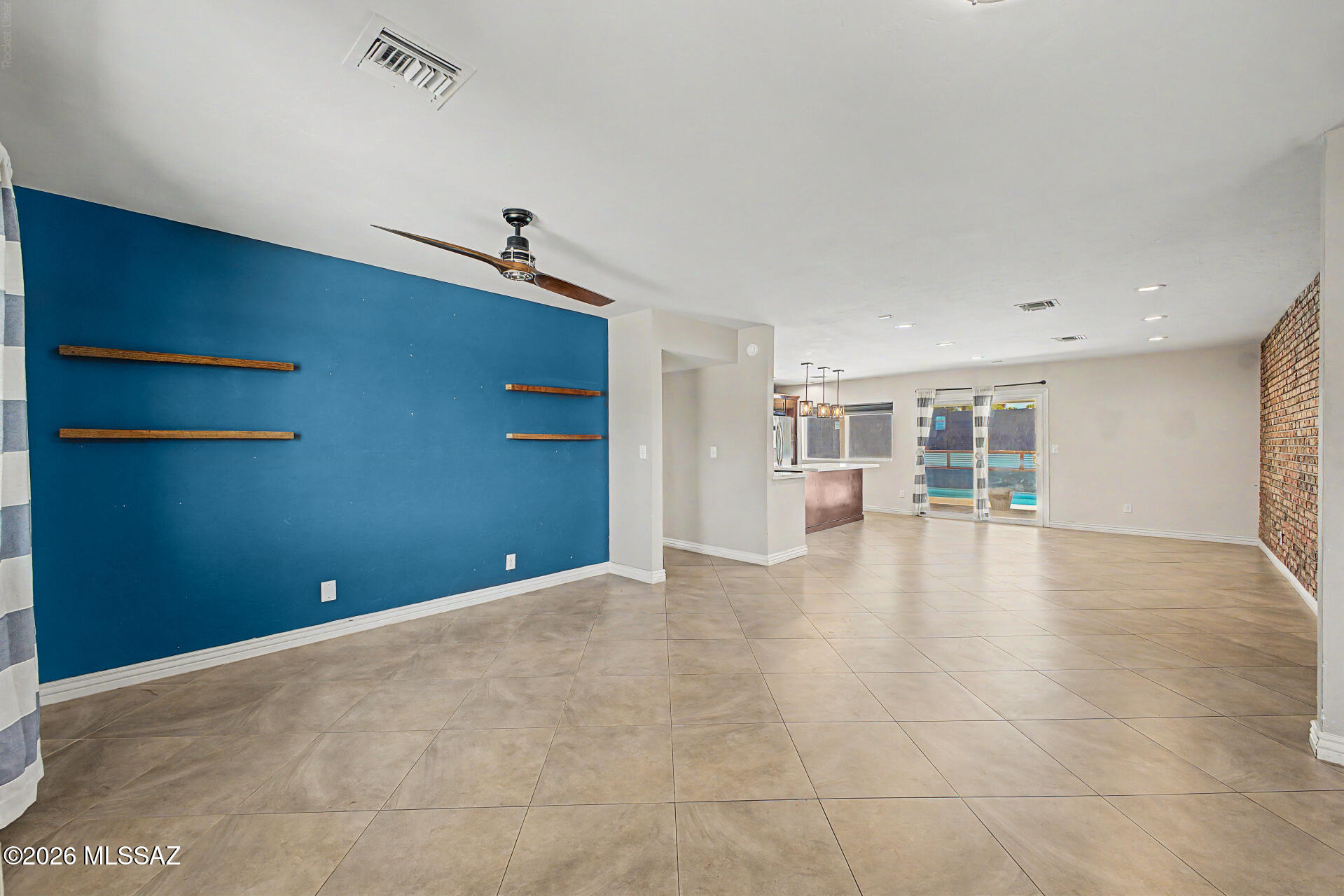 7550 East Rio Verde Drive Tucson, AZ 85715 - Photo 5 of 25 From the moment you walk in, the open concept design creates a seamless flow between living, dining & kitchen spaces.