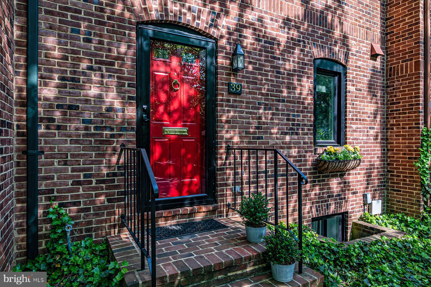 a view of a brick building with a red door