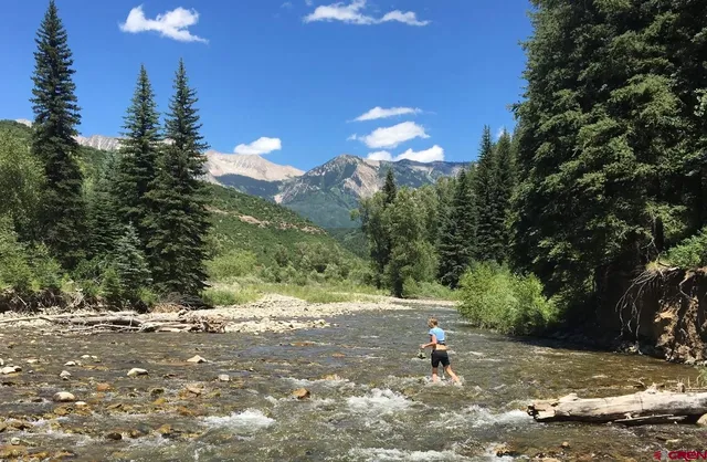 a view of a road with a building in the background