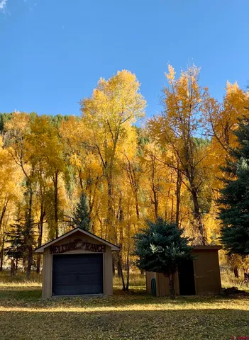 a view of mountain view with large trees
