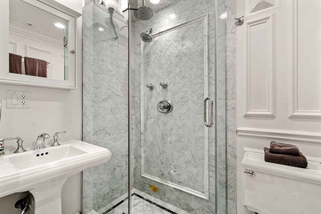 273 Commonwealth Avenue, Unit 9 Boston, MA 02116 - Photo 18 of 26 a bathroom with a sink a toilet and shower