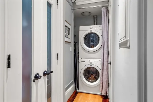 a view of a hallway with washer and dryer
