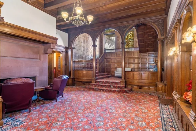 a view of hall way with furniture