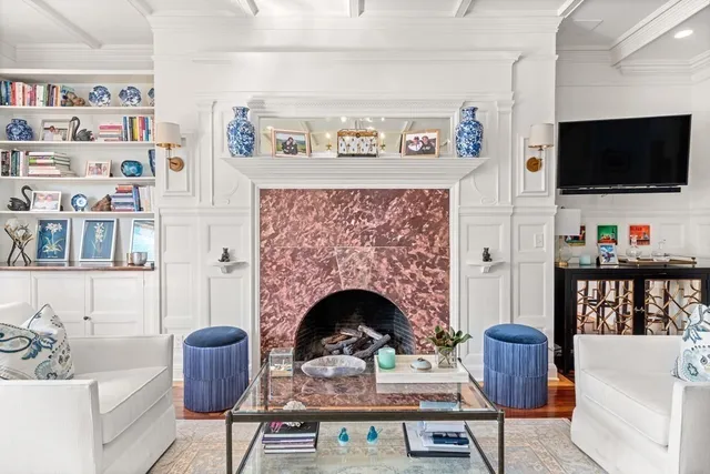 a living room with furniture fireplace and flat screen tv