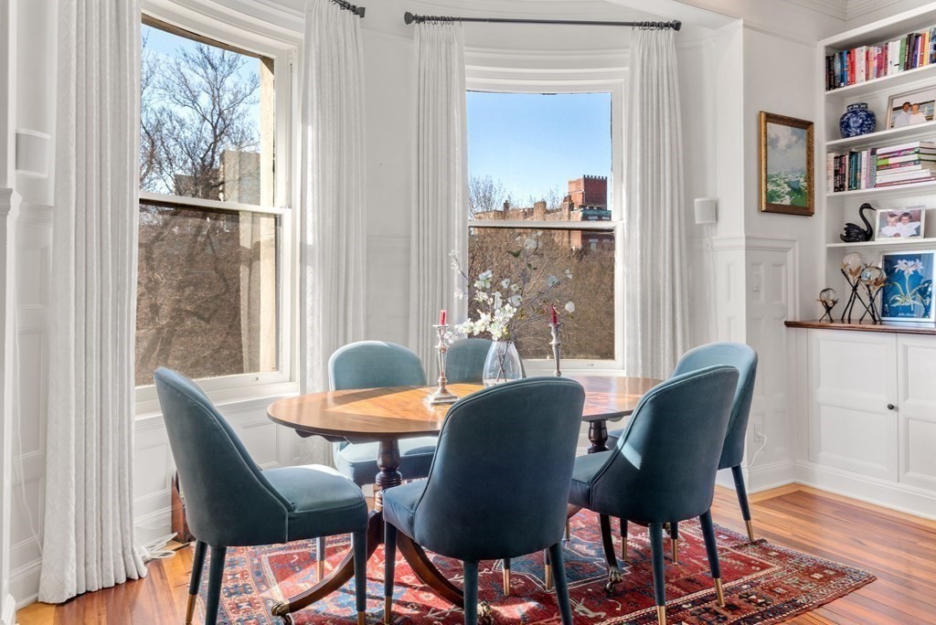 273 Commonwealth Avenue, Unit 9 Boston, MA 02116 - Photo 6 of 26 a dining room with furniture and window