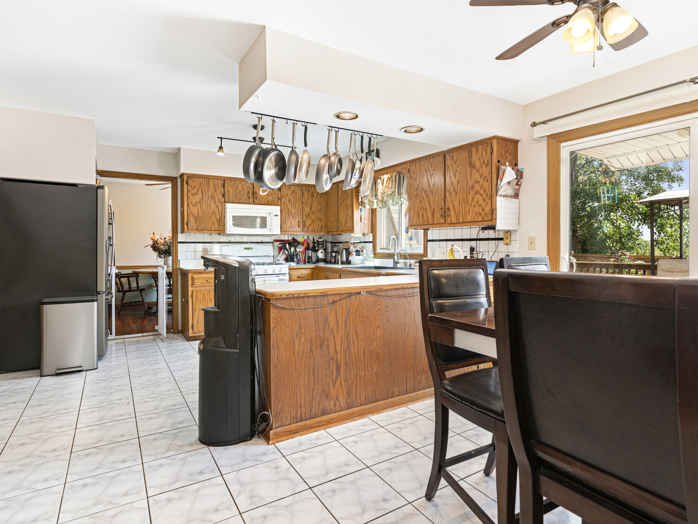 2333 Hess Drive Crest Hill, IL 60403 - Photo 11 of 26 a kitchen with stainless steel appliances granite countertop a stove refrigerator sink and microwave