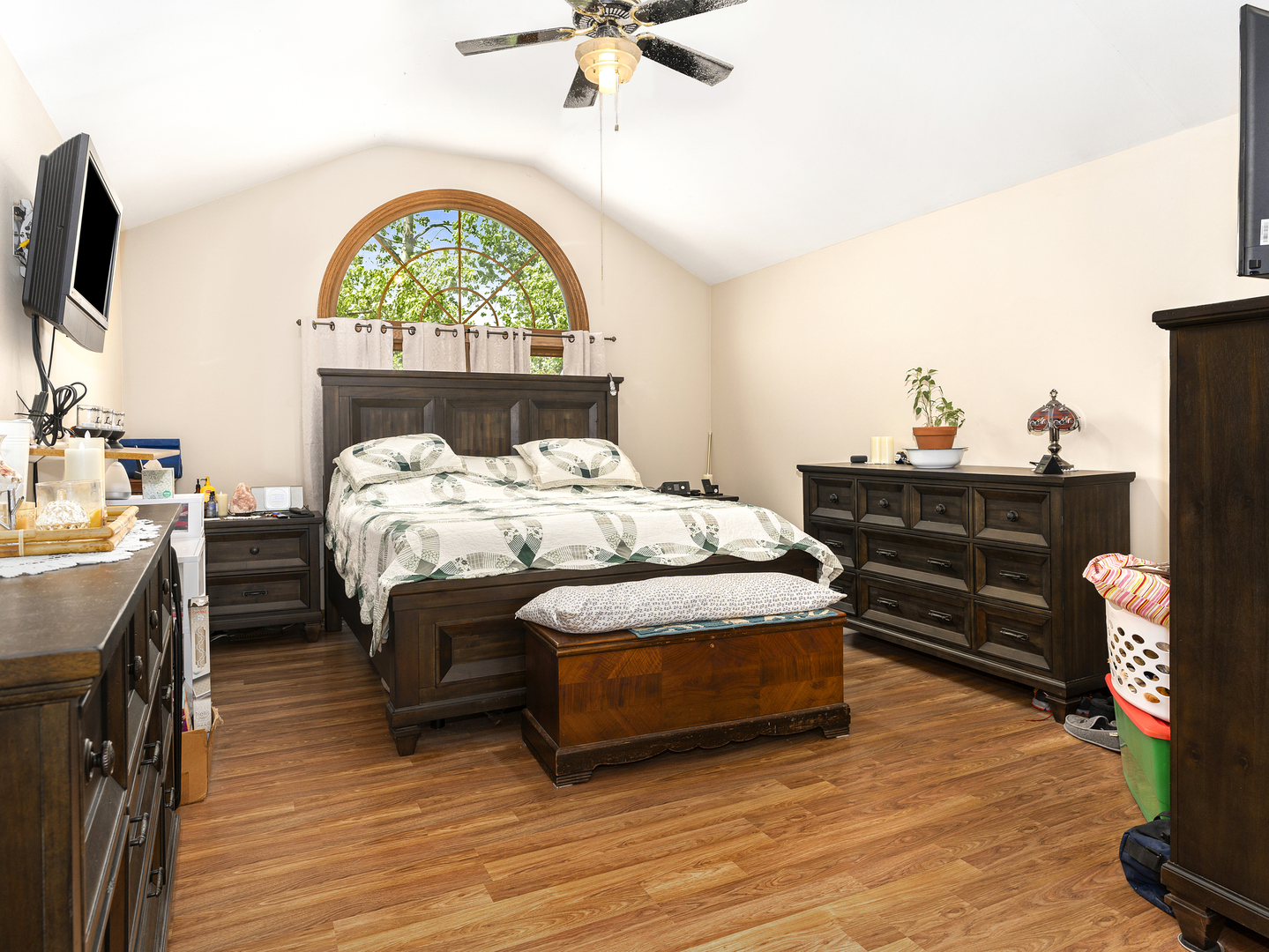 2333 Hess Drive Crest Hill, IL 60403 - Photo 17 of 26 a bedroom with a bed table and a flat screen tv