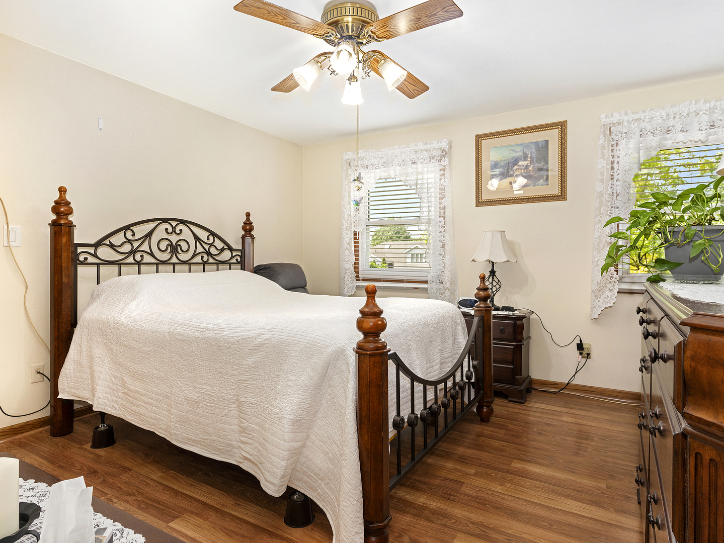 2333 Hess Drive Crest Hill, IL 60403 - Photo 19 of 26 a bedroom with a bed and a chandelier