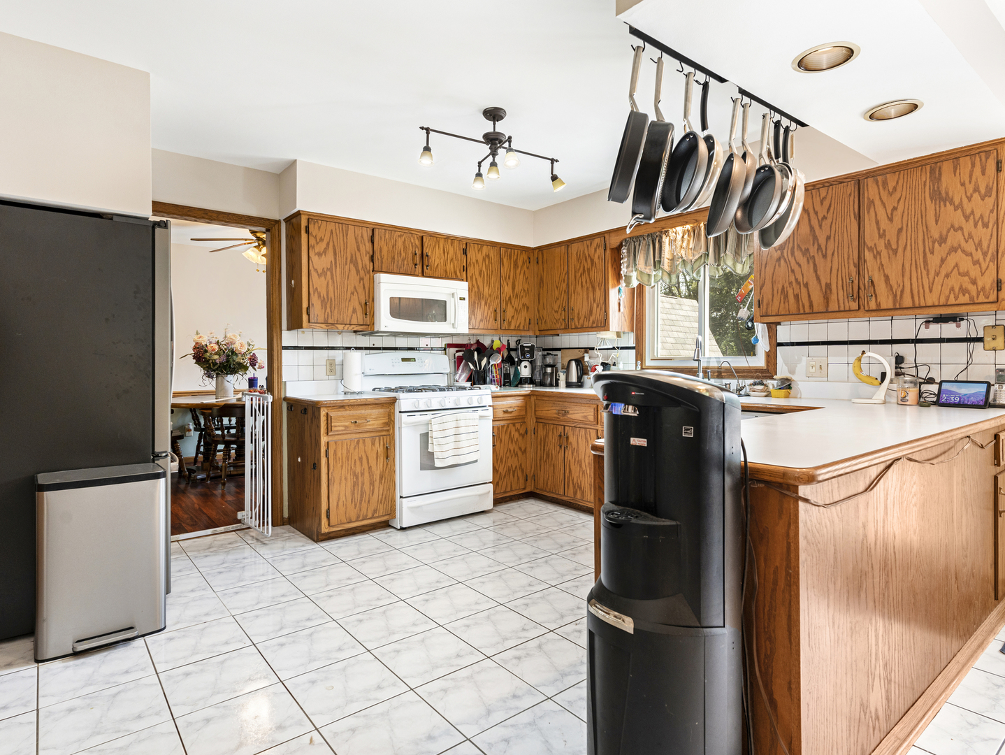 2333 Hess Drive Crest Hill, IL 60403 - Photo 7 of 26 a kitchen with stainless steel appliances granite countertop a stove a sink dishwasher and a refrigerator