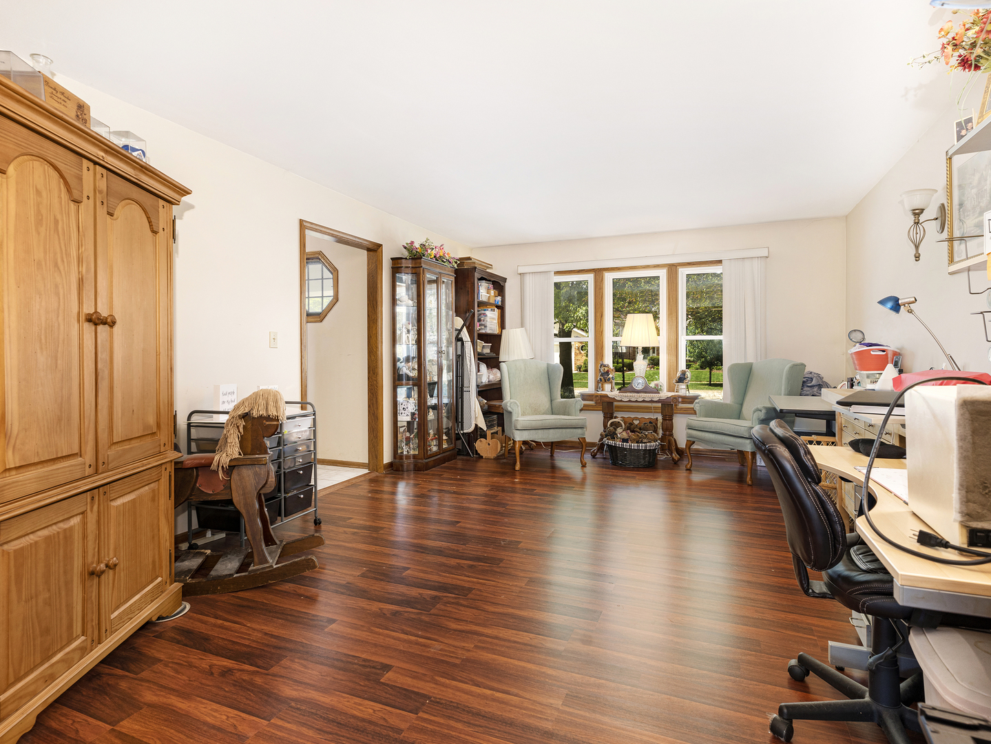 2333 Hess Drive Crest Hill, IL 60403 - Photo 9 of 26 a view of a livingroom with workspace and a large window