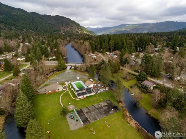 an aerial view of residential houses with outdoor space