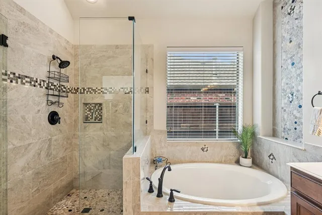 a white bath tub sitting next to a window
