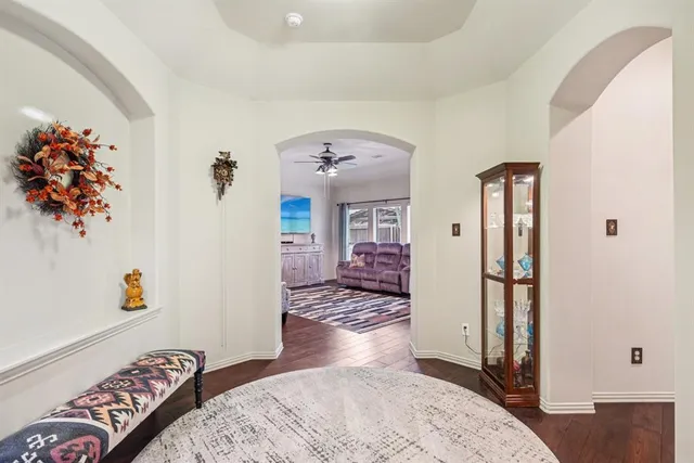 a view of a bedroom with wooden floor and closet
