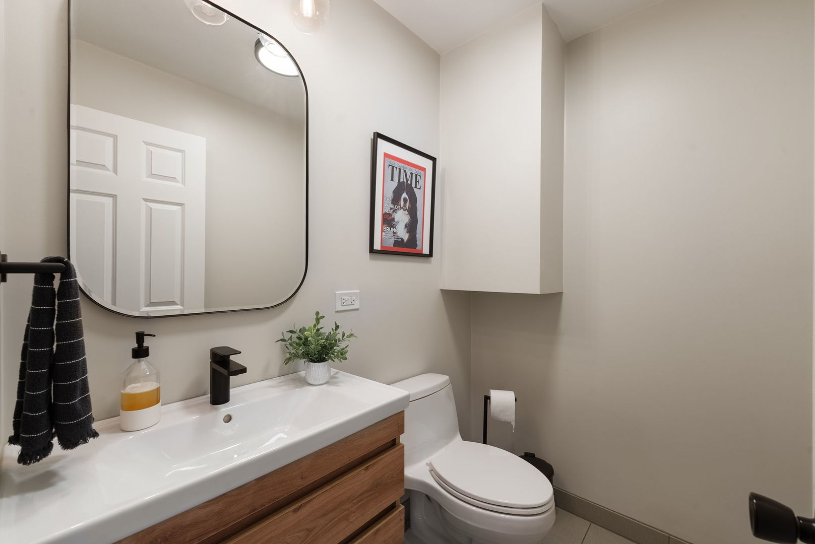 5045 Rochester Drive Hoffman Estates, IL 60010 - Photo 15 of 33 a bathroom with a sink mirror and toilet