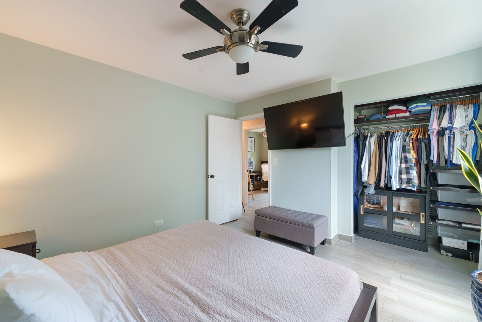 5045 Rochester Drive Hoffman Estates, IL 60010 - Photo 18 of 33 a bedroom with a bed and a flat screen tv