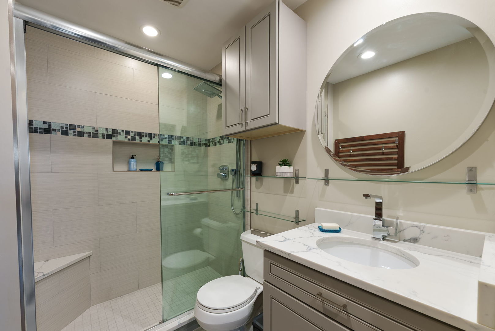5045 Rochester Drive Hoffman Estates, IL 60010 - Photo 19 of 33 a bathroom with a granite countertop sink a toilet a mirror and shower