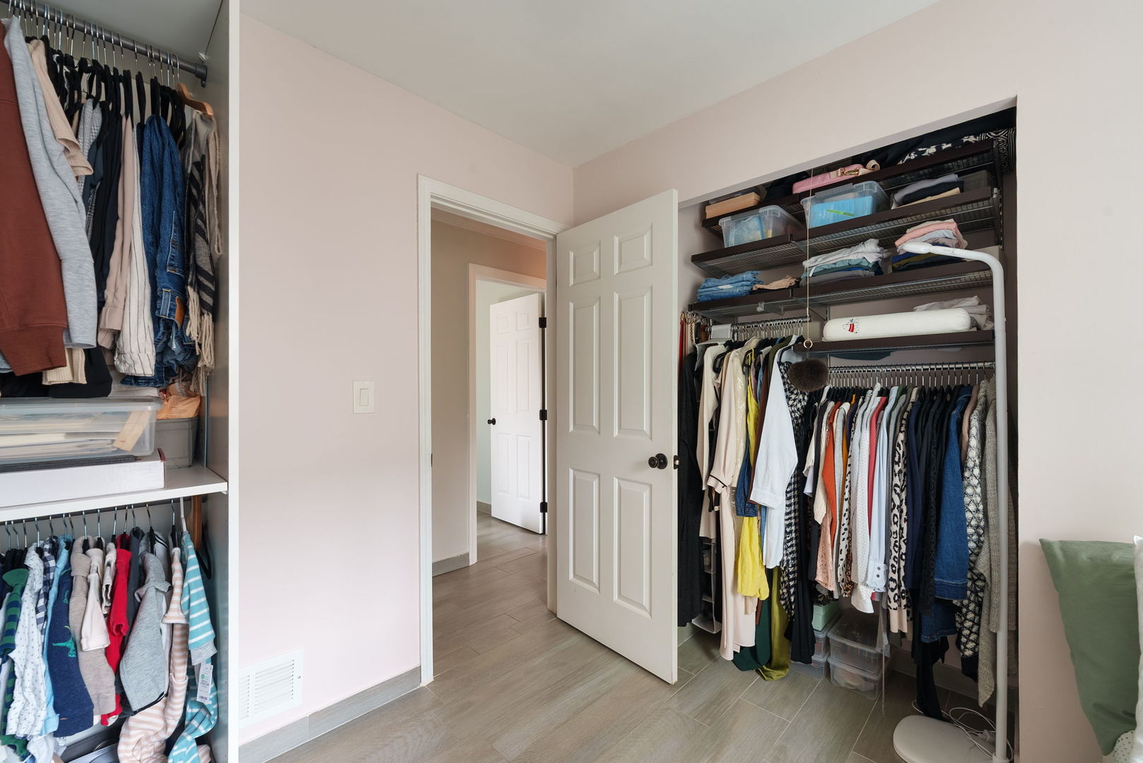 5045 Rochester Drive Hoffman Estates, IL 60010 - Photo 21 of 33 a view of walk in closet with clothes and shoes
