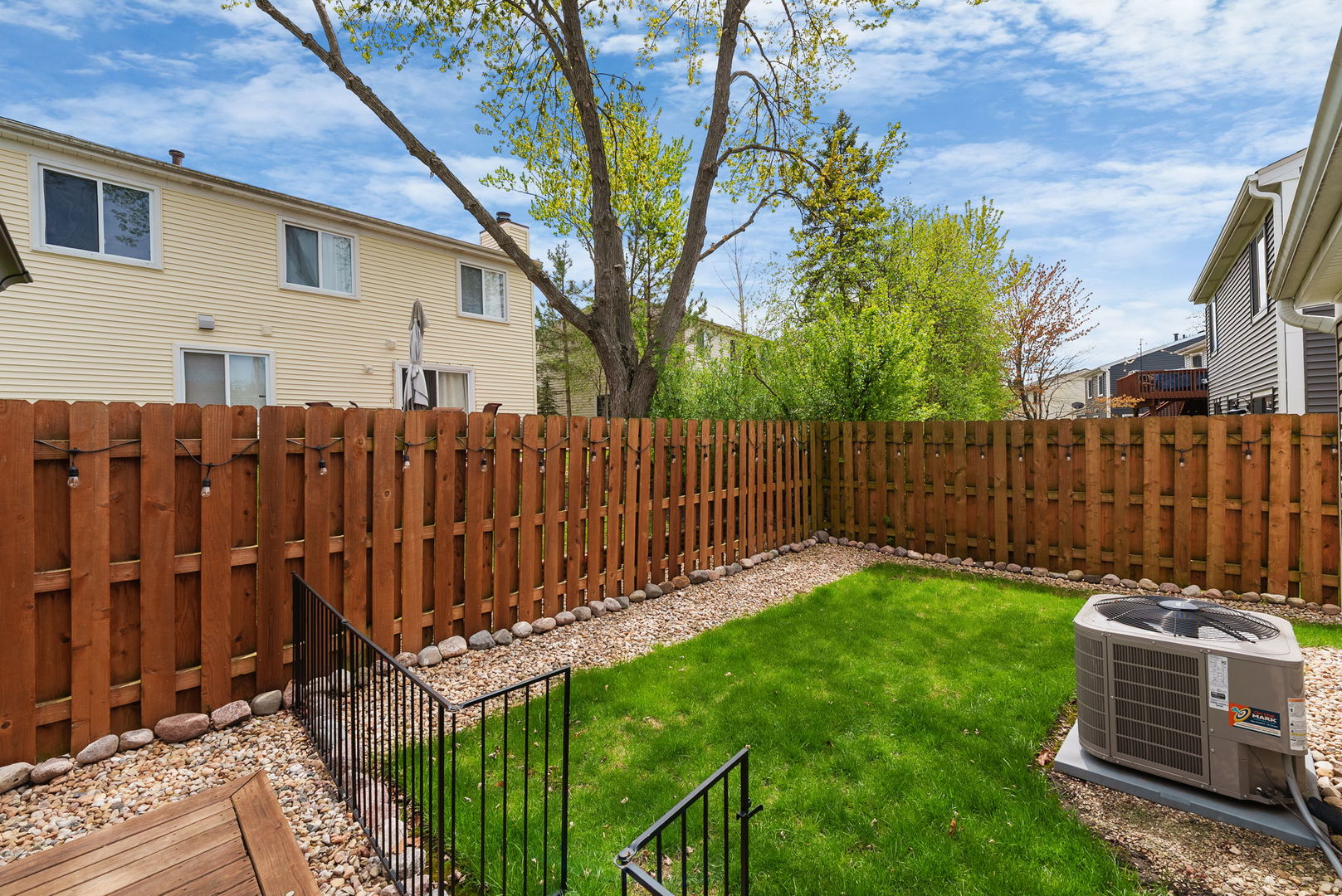 5045 Rochester Drive Hoffman Estates, IL 60010 - Photo 24 of 33 a view of a backyard with wooden fence