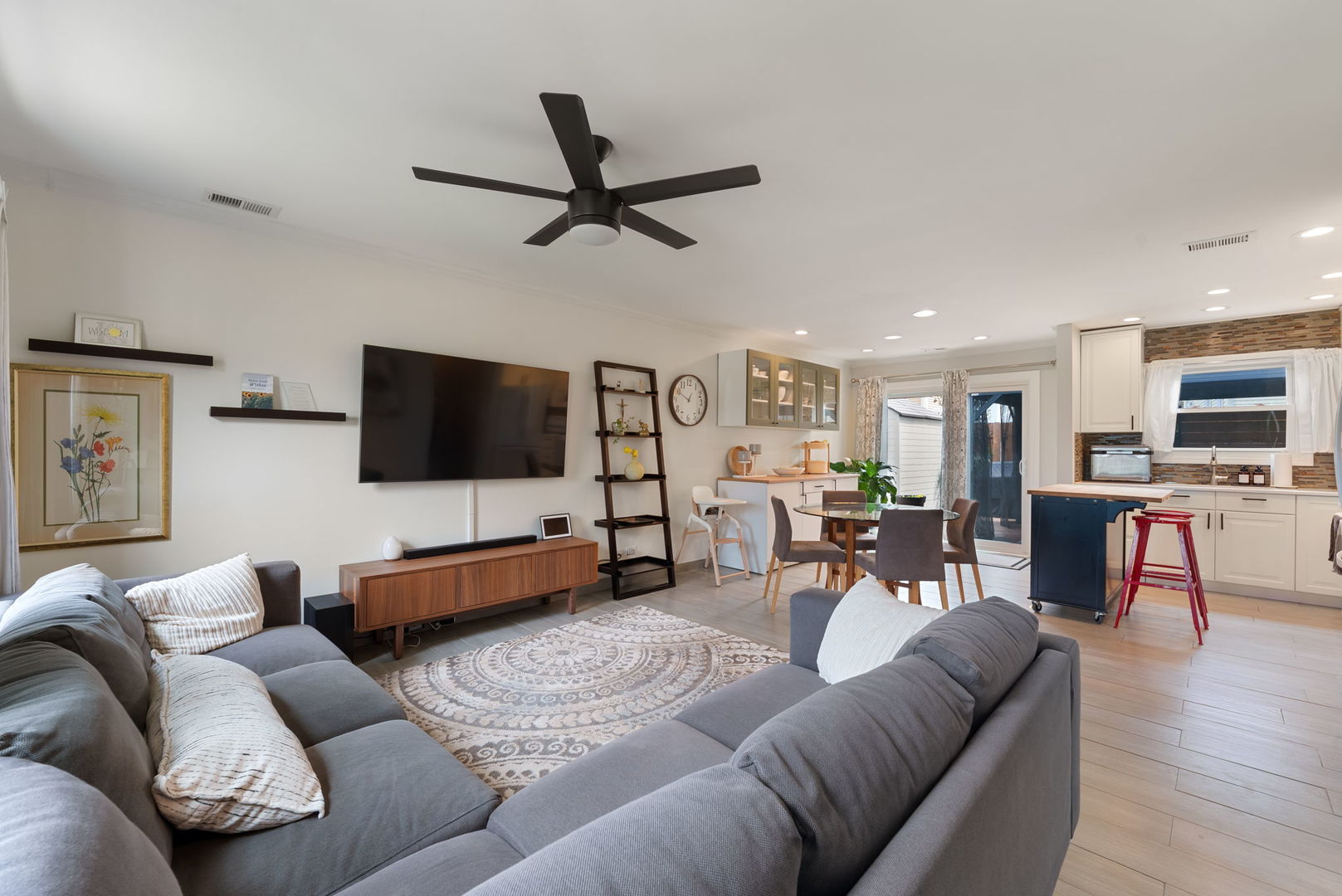 5045 Rochester Drive Hoffman Estates, IL 60010 - Photo 5 of 33 a living room with furniture and a flat screen tv