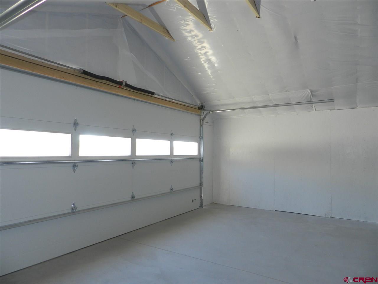 1720 6450 Road, Unit FINISHED GARAGE B Montrose, CO 81401 - Photo 5 of 8 a view of an empty room