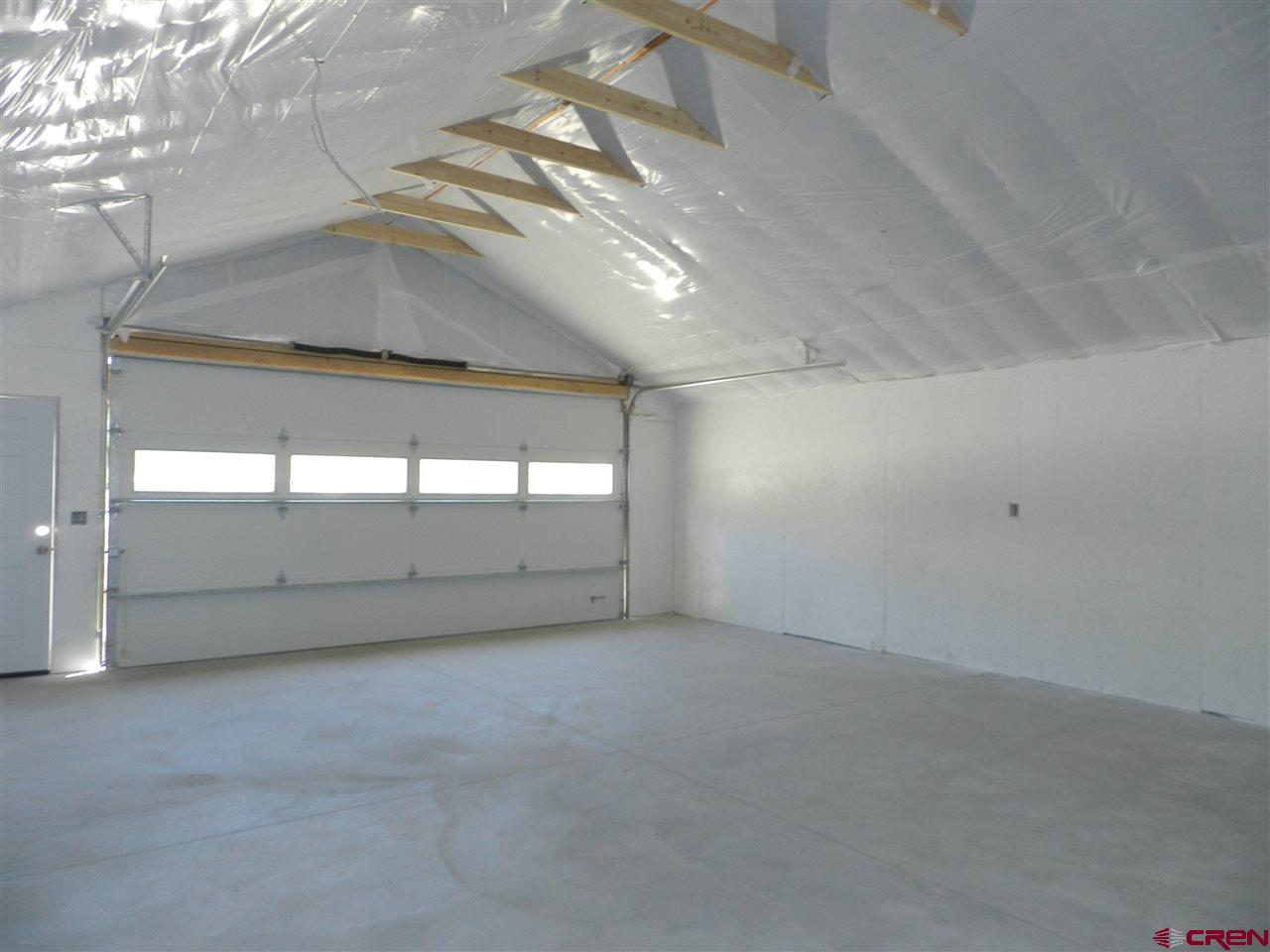 1720 6450 Road, Unit FINISHED GARAGE B Montrose, CO 81401 - Photo 6 of 8 a view of an empty room