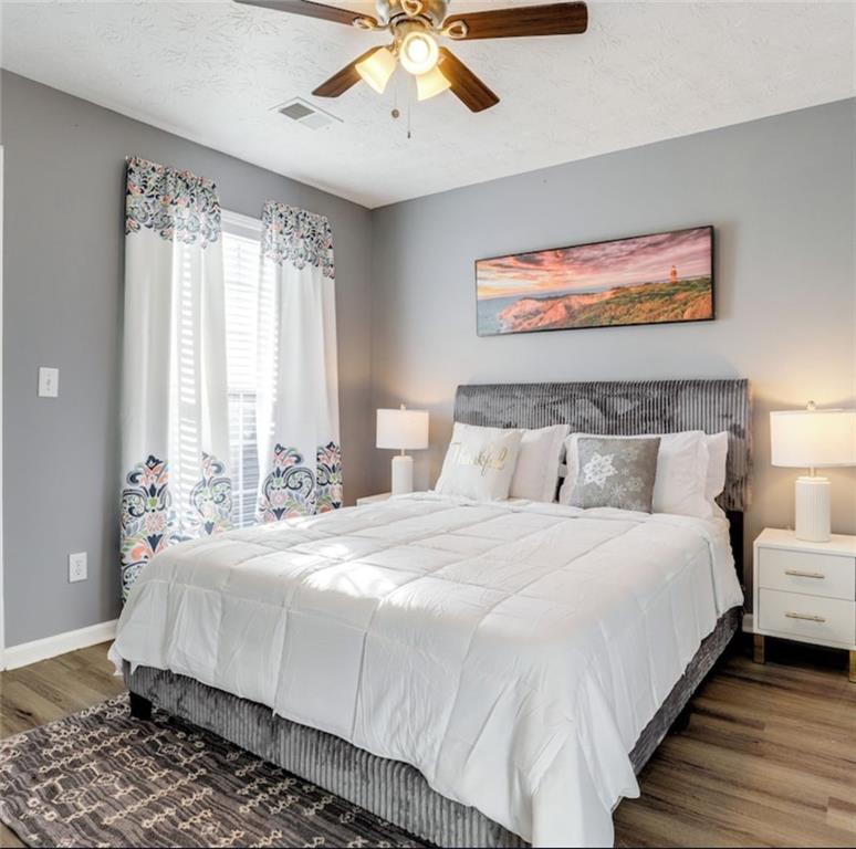 1080 Rafington Drive Lawrenceville, GA 30046 - Photo 12 of 19 a bedroom with bed and a window