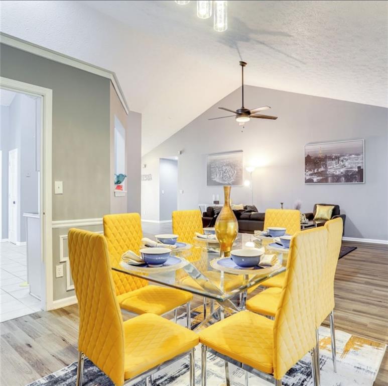 1080 Rafington Drive Lawrenceville, GA 30046 - Photo 14 of 19 a view of a dining room with furniture and wooden floor