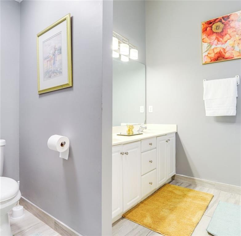 1080 Rafington Drive Lawrenceville, GA 30046 - Photo 2 of 19 a bathroom with a granite countertop sink and a mirror