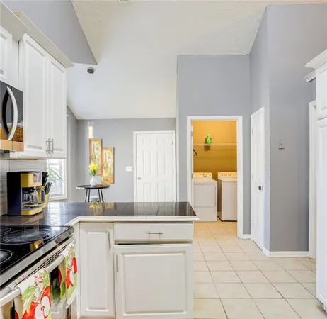 a kitchen with a stove and a sink