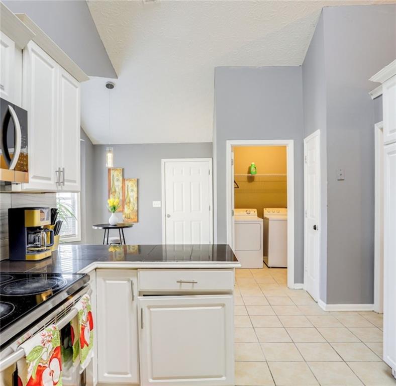 1080 Rafington Drive Lawrenceville, GA 30046 - Photo 7 of 19 a kitchen with a stove and a sink