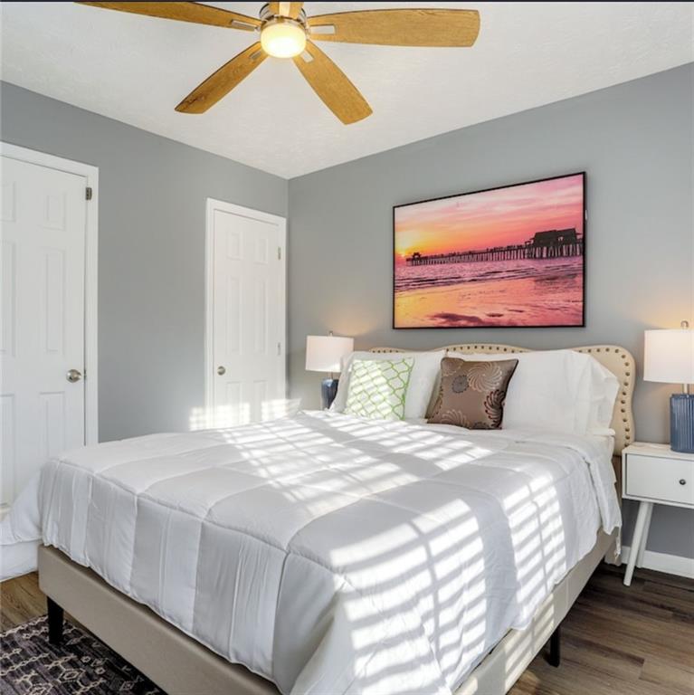1080 Rafington Drive Lawrenceville, GA 30046 - Photo 9 of 19 a bedroom with bed and a painting on the wall