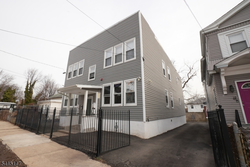 14 Hazel Place Newark, NJ 07108 - Photo 2 of 10 a view of a house with a street