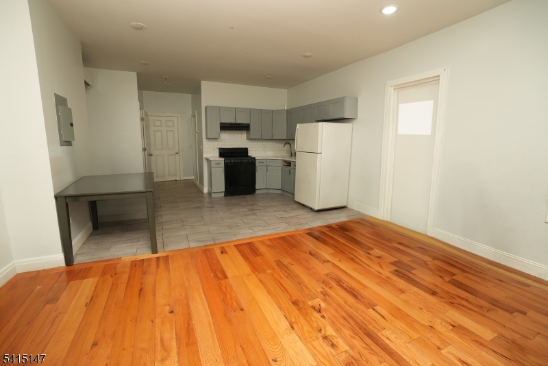 14 Hazel Place Newark, NJ 07108 - Photo 4 of 10 a room with a bed and cabinets